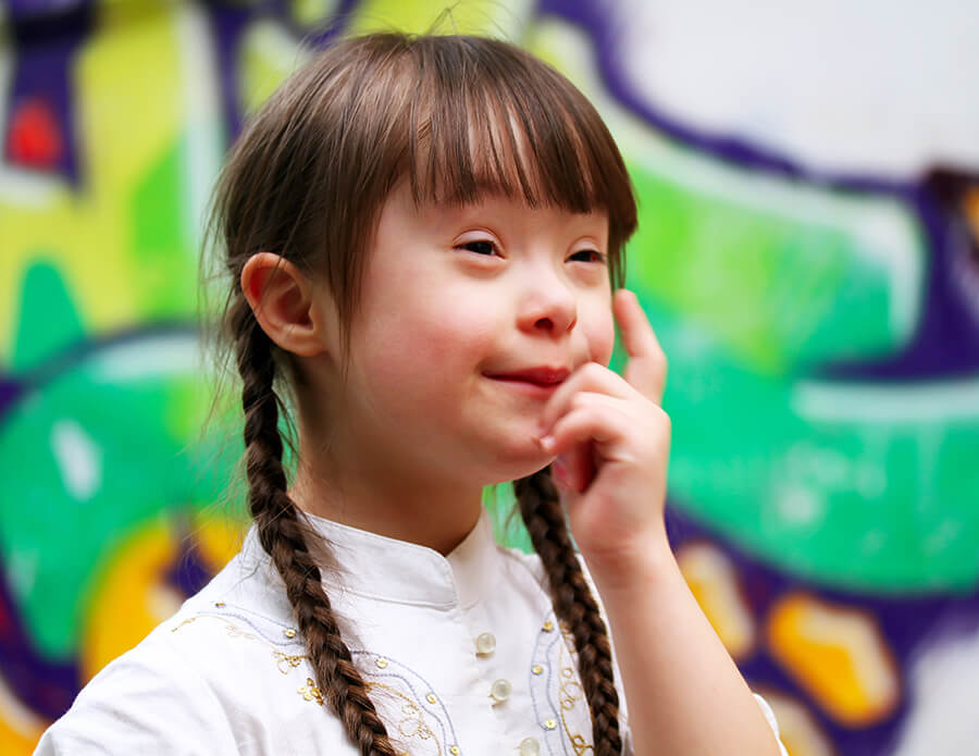 girl thinking with her finger by her temple